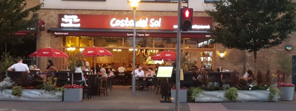 The Costa del Sol tapas bar frontage in Horley at dusk