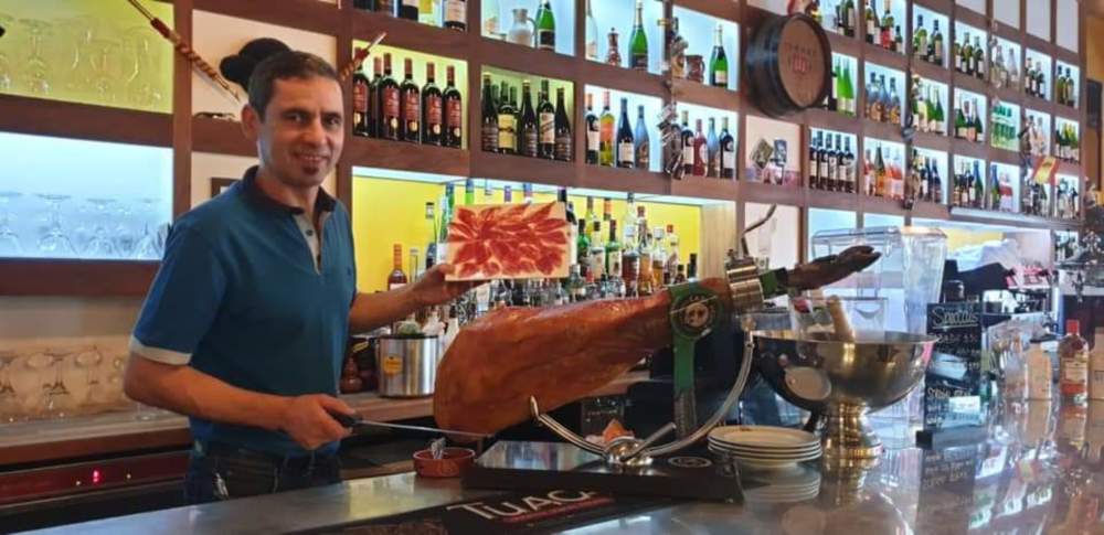 Jamón Ibérico being hand-carved at Costa del Sol's bar