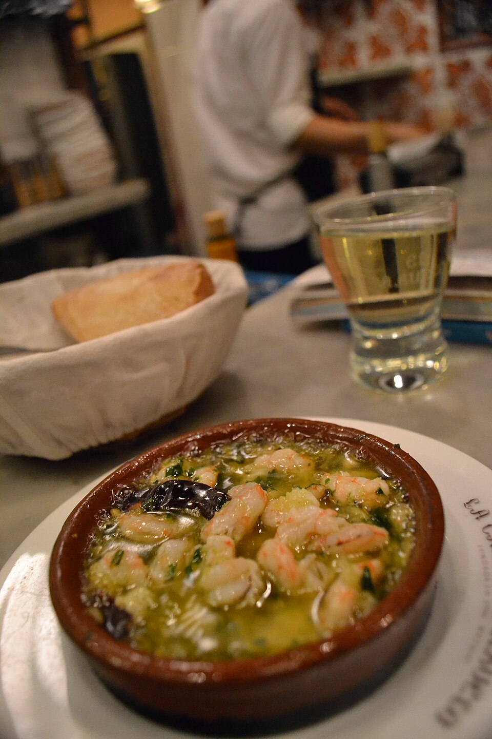 Gambas al ajillo — king prawns in garlic and olive oil, served in a terracotta cazuela